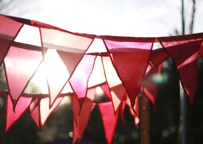 Colorful bunting available for purchase online, perfect for parties, weddings, and outdoor events.