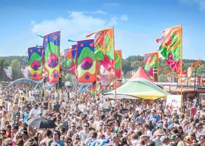 Crowd enjoying the vibrant and colorful Elrow Festival, known for its immersive atmosphere and dynamic performances.