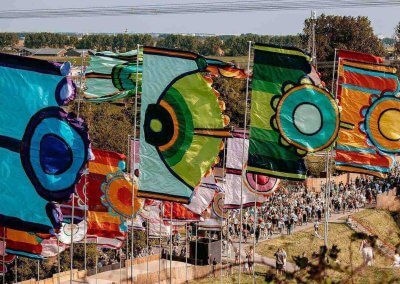 Event flags in the UK displayed at an outdoor festival, showcasing vibrant designs and quality craftsmanship.