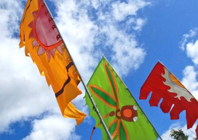 Festival flag banner displayed at an event, featuring vibrant colors and dynamic design to enhance the celebration atmosphere.