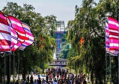 Festival flags displayed at a music and cultural festival, adding vibrant colors and energy to the atmosphere.