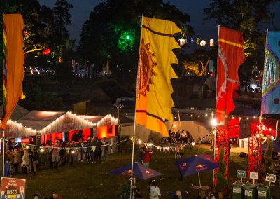 Festival flags in the UK at a lively outdoor event, adding vibrant colors and a festive atmosphere.