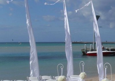 Elegant wedding decoration flags on the beach, creating a romantic and festive atmosphere for a special day.